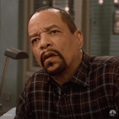 Man With Beard In Plaid Shirt With NBC Logo GIF