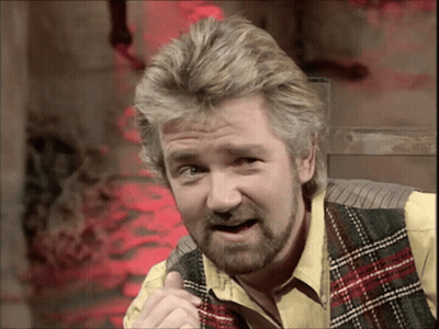 Man With Beard In Plaid Vest And Yellow Shirt GIF