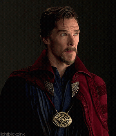 Man With Beard In Red Cape And Gold Pendant GIF