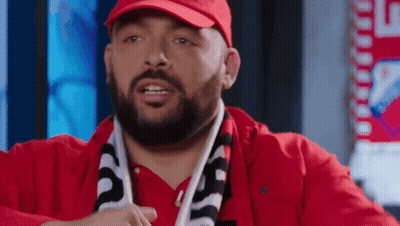 Man With Beard In Red Hat And Scarf Saying Supreme GIF