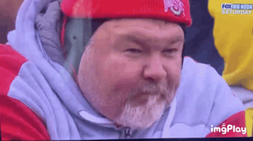 Man With Beard In Red Hat And White Jacket GIF