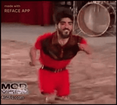 Man With Beard In Red Shirt And Shorts Dancing At Drums GIF