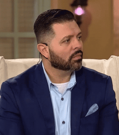 Man With Beard In Suit And Headset GIF