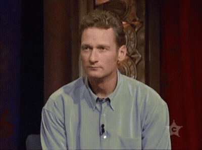 Man With Beard In Suit Sitting GIF
