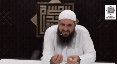 Man With Beard In White Hat Sitting At Table GIF