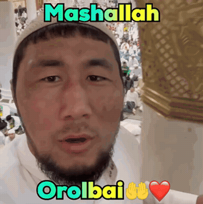 Man With Beard In White Shirt And Hat Says Mashallah Orolbai GIF