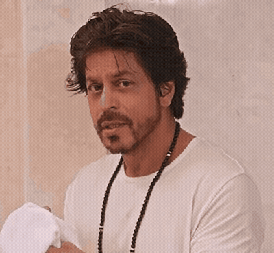 Man With Beard In White Shirt And Necklace GIF