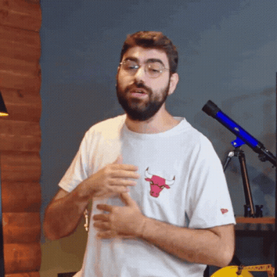Man With Beard In White Shirt With Bull GIF
