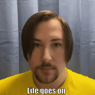 Man With Beard In Yellow Shirt Saying Life Goes On GIF