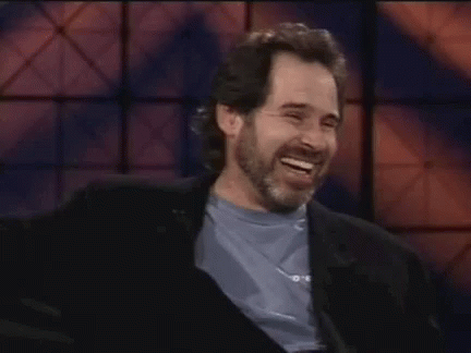 Man With Beard Laughing In Blue Shirt GIF