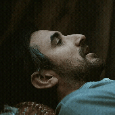 Man With Beard Laying Down Eyes Closed GIF