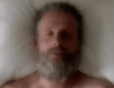 Man With Beard Laying In Bed GIF