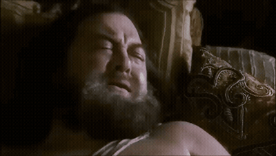Man With Beard Laying In Bed Saying Give Me Something For The Cringe And Let Me Die GIF
