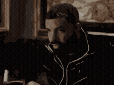 Man With Beard Looking At Cell Phone GIF