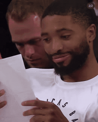 Man With Beard Looking At Paper GIF