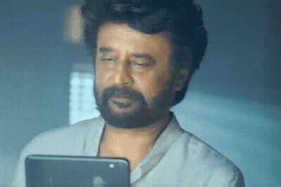 Man With Beard Looking At Tablet Computer GIF