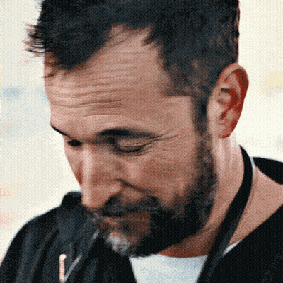 Man With Beard Looking Down GIF
