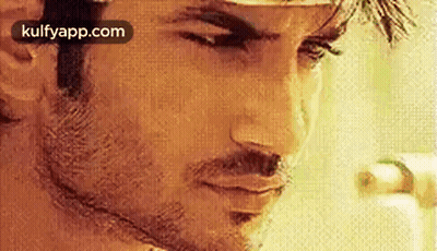 Man With Beard Looking Down GIF