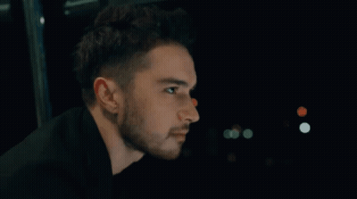 Man With Beard Looking In Dark GIF