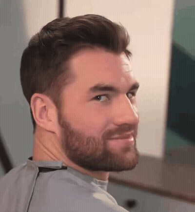 Man With Beard Looking Over Shoulder GIF
