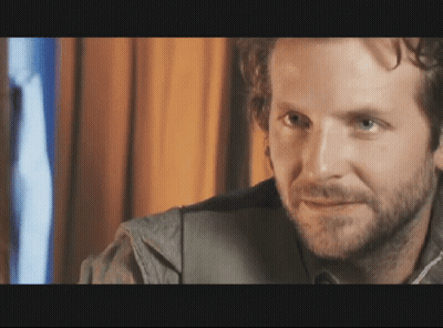 Man With Beard Looks At Camera GIF