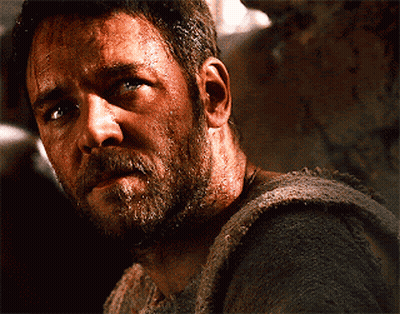 Man With Beard Looks At Camera GIF