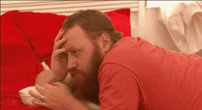Man With Beard Lying On Bed GIF