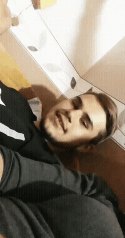 Man With Beard Lying On Floor Eyes Closed GIF