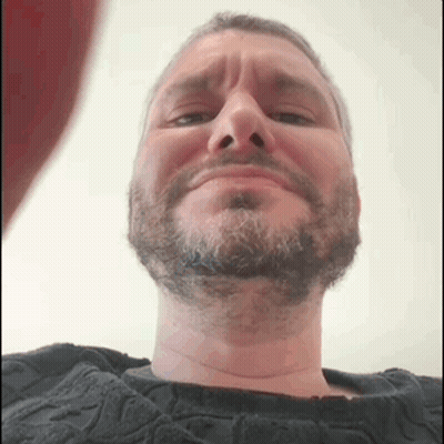 Man With Beard Making Funny Face In Black Sweater GIF