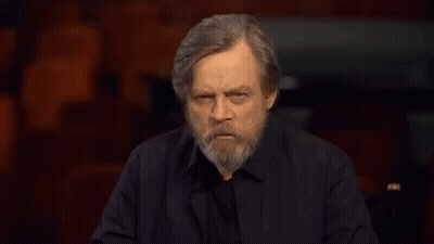 Man With Beard Making Funny Face In Dark Room GIF