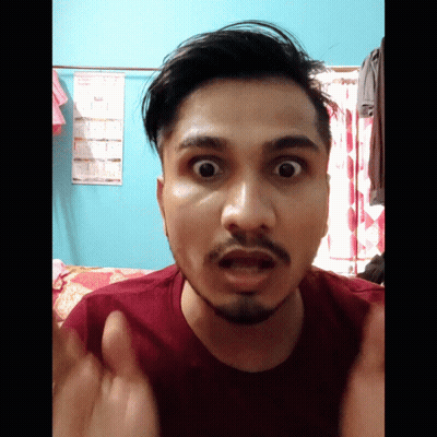 Man With Beard Making Funny Face In Front Of Calendar GIF