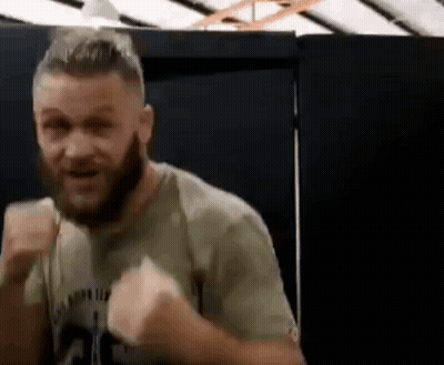 Man With Beard Making Funny Face In Gym GIF