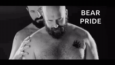 Man with Beard Next to Man with Bear Paw Tattoo