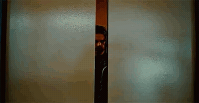 Man With Beard Peeking Out Of Doorway GIF