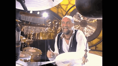 Man With Beard Playing Drums GIF