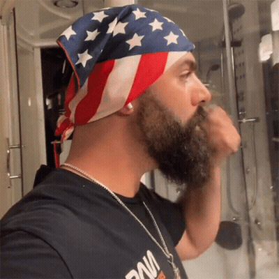 Man With Beard Playing Guitar In A Band With Drummer GIF