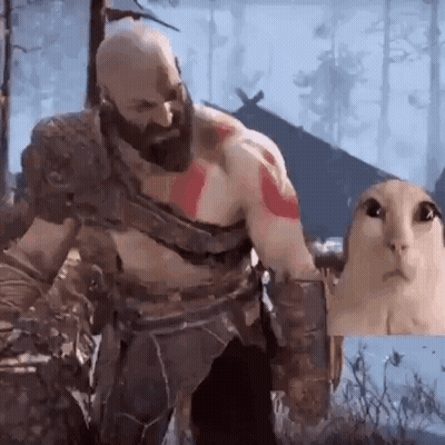 Man With Beard Playing Video Game With Cat Behind Him GIF