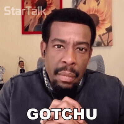 Man With Beard Saying Gotchu In Front Of Sunflower GIF