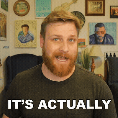 Man With Beard Saying It's Actually In Front Of Pictures GIF