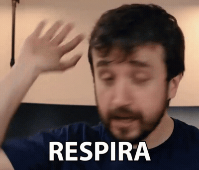 Man With Beard Saying Respira With Hand GIF