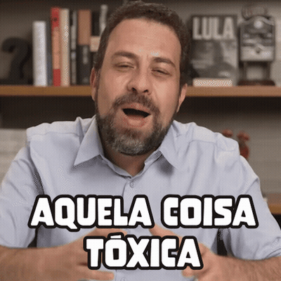 Man With Beard Says Aquela Coisa Toxica In Front Of Bookshelf GIF