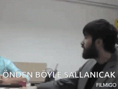 Man With Beard Sitting At Desk Saying Ondan Boyle Salanicak GIF