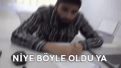 Man With Beard Sitting At Laptop Says Niye Böyle Oldu Ya GIF