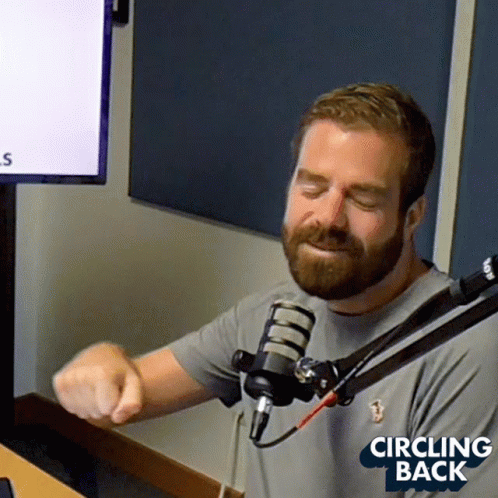 Man With Beard Sitting At Microphone GIF
