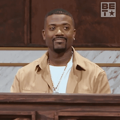 Man With Beard Sitting At Podium Saying Be GIF