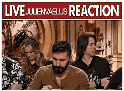 Man With Beard Sitting At Table In Front Of Live Juliewaeus Reaction Sign GIF