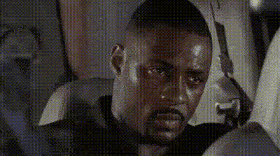 Man With Beard Sitting In Car Holding Gun GIF