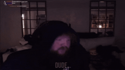 Man With Beard Sitting In Dark Room Saying My Stomach Hurting Right Now GIF