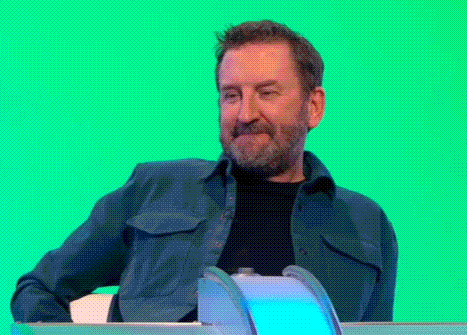 Man With Beard Sitting In Front Of Green Screen GIF