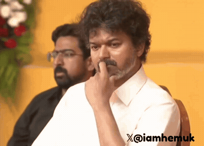 Man With Beard Sitting In Front Of Yellow Wall With X@iamhemuk GIF